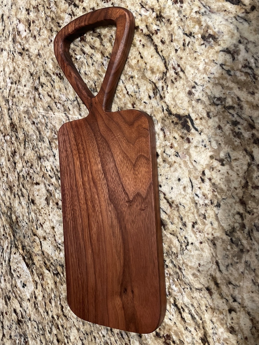 Custom handle walnut cutting board